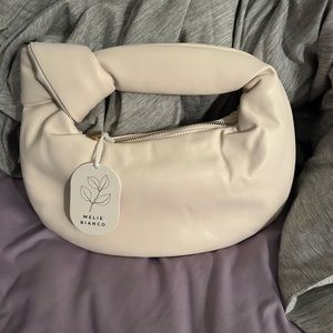 Melie Bianco hand bag. Never used. Brand new with tages. Cream color.